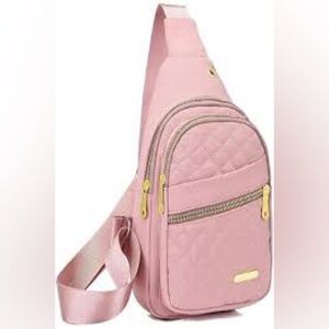 Pink Cross Body Backpack with gold zipper pockets